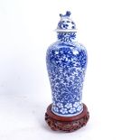 A Chinese blue and white porcelain baluster jar and cover, allover scrolled floral decoration,