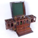 A 19th century walnut travelling Apothecary's cabinet, with sectioned fold-out interior and 3