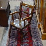 An Antique elm-seat child's armchair