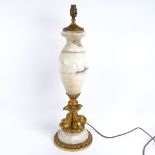 A large white marble and gilt-bronze mounted urn table lamp, with quadruple dolphin support,