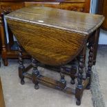 A small oak oval barley twist gateleg table, W76cm, H72cm