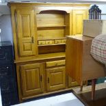 A modern light oak 2-section dresser, fitted with open shelves, spice drawers, and panelled