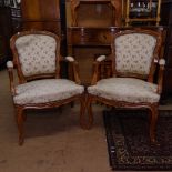 A pair of French carved beech-framed and upholstered open bedroom chairs