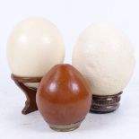 2 ostrich eggs on stands, and a pot made from a nut with brass mount (3)