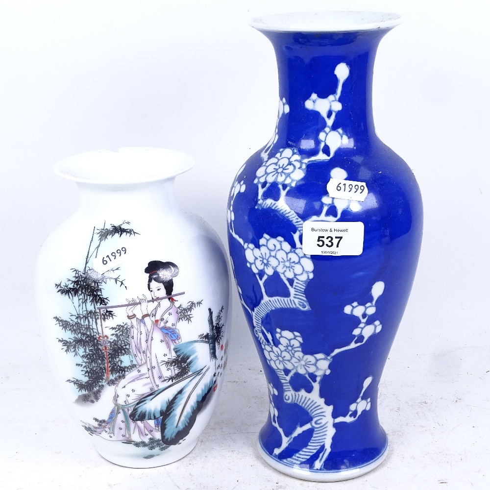 A Chinese blue and white Prunus pattern baluster vase, with 4 character mark, and a modern