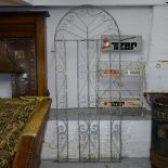 A galvanised arch-top garden gate, with scrolled decoration, H194cm, W80cm