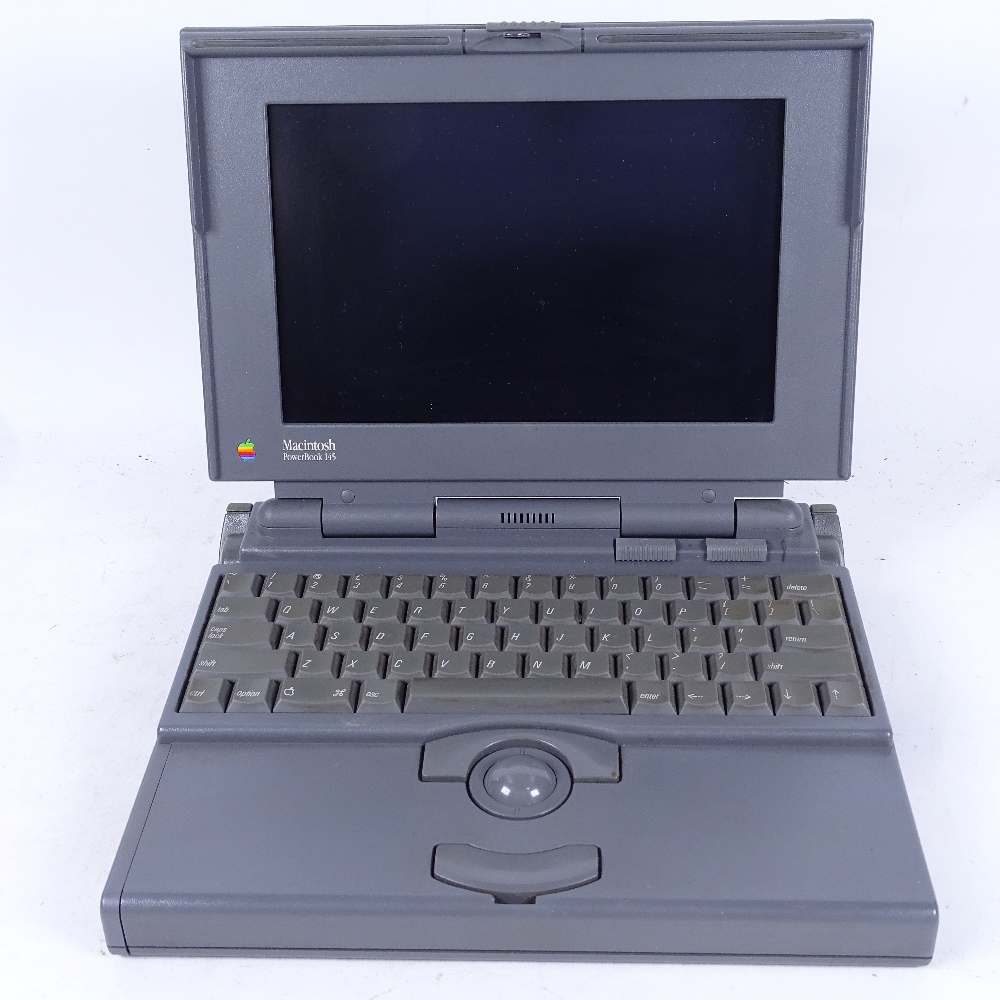 An Apple Powerbook 145 laptop computer, serial no. CK242084463, not seen working, with 8 software