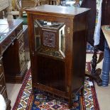 An Edwardian simulated rosewood music cabinet, with single glazed and panelled door, W50cm,