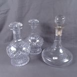 A modern glass ship's decanter with sterling silver collar, and a pair of moulded glass decanters,