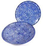 2 Moroccan blue and white pottery chargers, largest diameter 38.5cm, 1 A/F, (2)