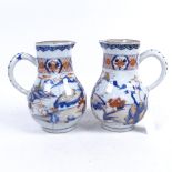 A pair of Imari porcelain jugs with painted and gilded decoration (A/F), height 20.5cm