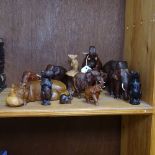 A group of carved wood animals, including a trumpeting elephant, height 15.5cm