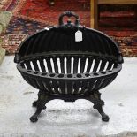 A modern cast-iron duck's nest fire grate, W45cm