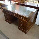 A reproduction mahogany twin-pedestal writing desk, with fitted drawers, W76cm