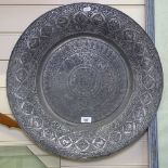 A large Eastern tinned copper deep dish, with allover engraving, 53cm