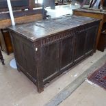 A George III panelled oak coffer on stile legs, W133cm, H70cm, D61cm