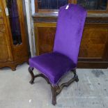 An 18th century upholstered high-back side chair, on walnut cabriole legs