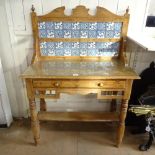 An Antique pine washstand, with raised tile back, single frieze drawer, on turned legs, W91cm,