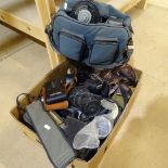 A box of various cameras and related equipment, including a Kodak folding camera