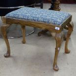 An Edwardian walnut dressing stool on cabriole legs, W65cm, H51cm