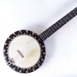 A Vintage banjo with silver plated mounts, and a carrying case
