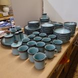 Japanese stoneware cups and saucers, and matching dinnerware, including bowls and plates, by