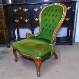 A mahogany-framed button-back upholstered nursing chair