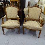 A pair of stained and carved beech-framed open arm salon chairs on cabriole legs