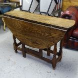 An Antique joint oak oval gateleg table, on baluster turned legs, W112cm