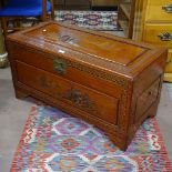A Chinese camphorwood blanket chest, with relief carved decoration, W93cm, H50cm, D45cm