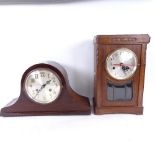 An oak-cased battery operated clock, and a Napoleon hat 2-train mantel clock, length 36cm