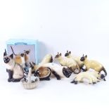A group of Siamese cat figures, including Tony Raymond seated cat, height 17cm