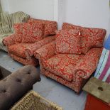 A pair of Laura Ashley upholstered armchairs, with loose cushions, turned legs and brass casters