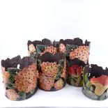 A set of 4 pierced and painted metal planters, tallest 26cm, and 2 small similar floral planters