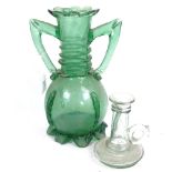 A 19th century green glass vase with applied decoration, 28.5cm, and an Antique glass candlestick