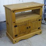 A Mexican pine side cabinet with cupboard doors, W84cm, H79cm, D43cm