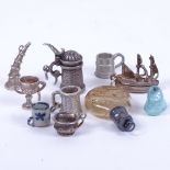 A group of miniature charms, to include scent bottle, flagons etc