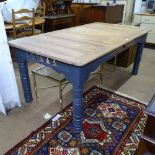 A large rectangular polished and painted pine kitchen table, on turned legs, L180cm, H76cm, D100cm