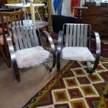 A pair of Art Deco design nickel plated steel armchairs, with circular sides and sheepskin seat pads