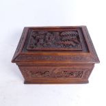 A late 19th/early 20th century Chinese carved hardwood box, relief carved lid with allover floral