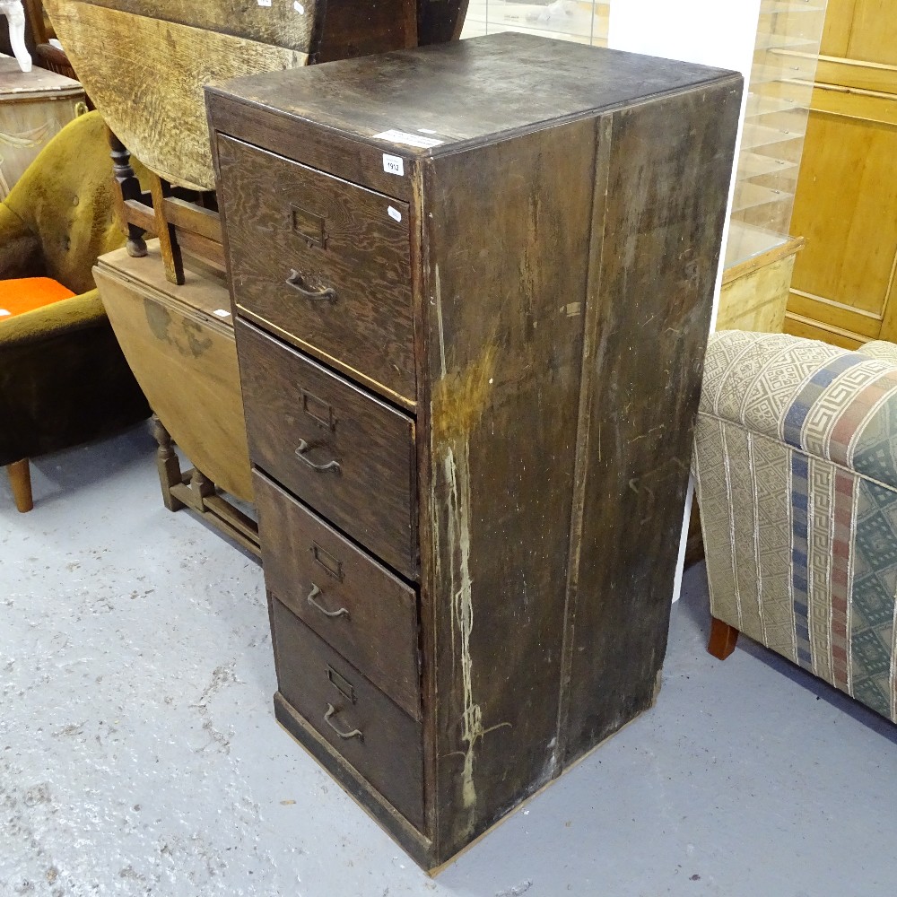 A 1920s oak 4-drawer filing cabinet, W53cm, H133cm