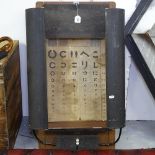 An unusual mid-century optometrist's eye chart with lights