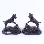 After Edouard Drouot, a pair of patinated bronze sculptures, Terriers, on serpentine veined marble