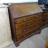 A George III mahogany and satinwood-strung bureau, with fitted interior, 3 long graduated drawers