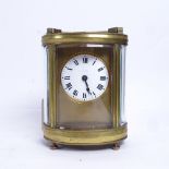 A 19th century oval brass-cased carriage clock timepiece, white enamel dial with Roman numeral