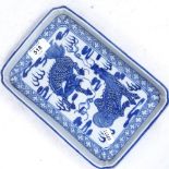A Chinese blue and white rectangular porcelain tray, double mythical Qilin decoration, surrounded by