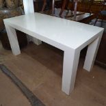 A contemporary rectangular white desk/table with single drawer, retailed by Jonathan Adler,