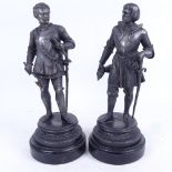 A pair of spelter knight figures on wooden plinths, 30.5cm