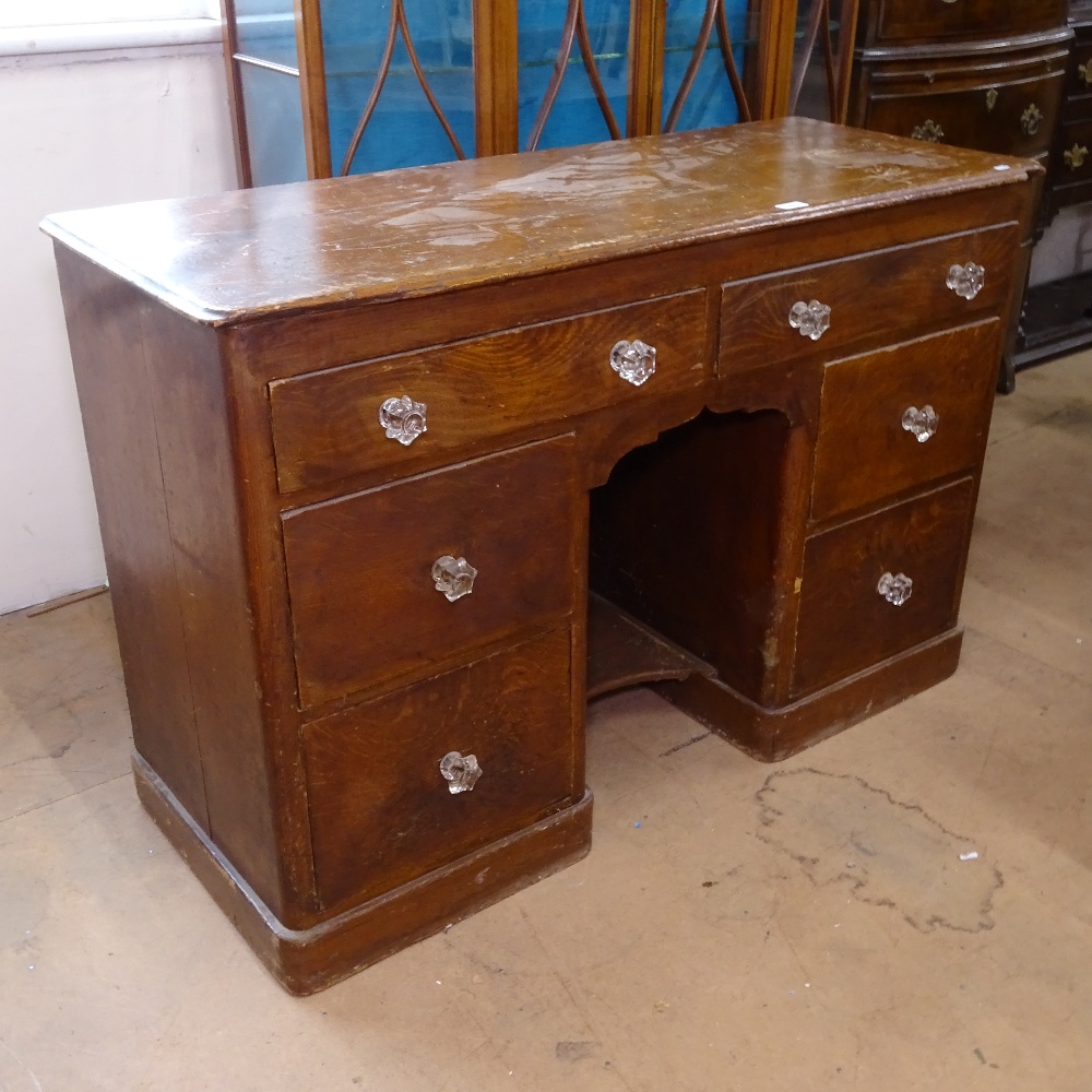 A Victorian pine knee-hole writing desk, with 6 short drawers and original finish, W123cm, H82cm,