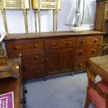 A Victorian pitch pine cabinet, with fitted short drawers and central panelled cupboard, L203cm,